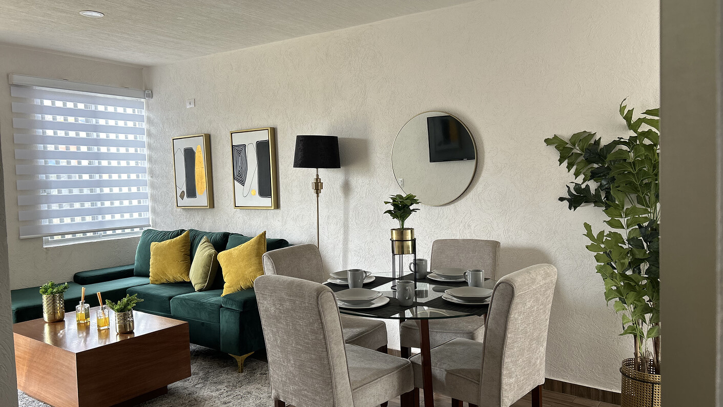 vista de sala de estar y comedor de casa de modelo cipres en desarrollo residencial paseos del bosque en el estado de Aguascalientes Mexico frindsa