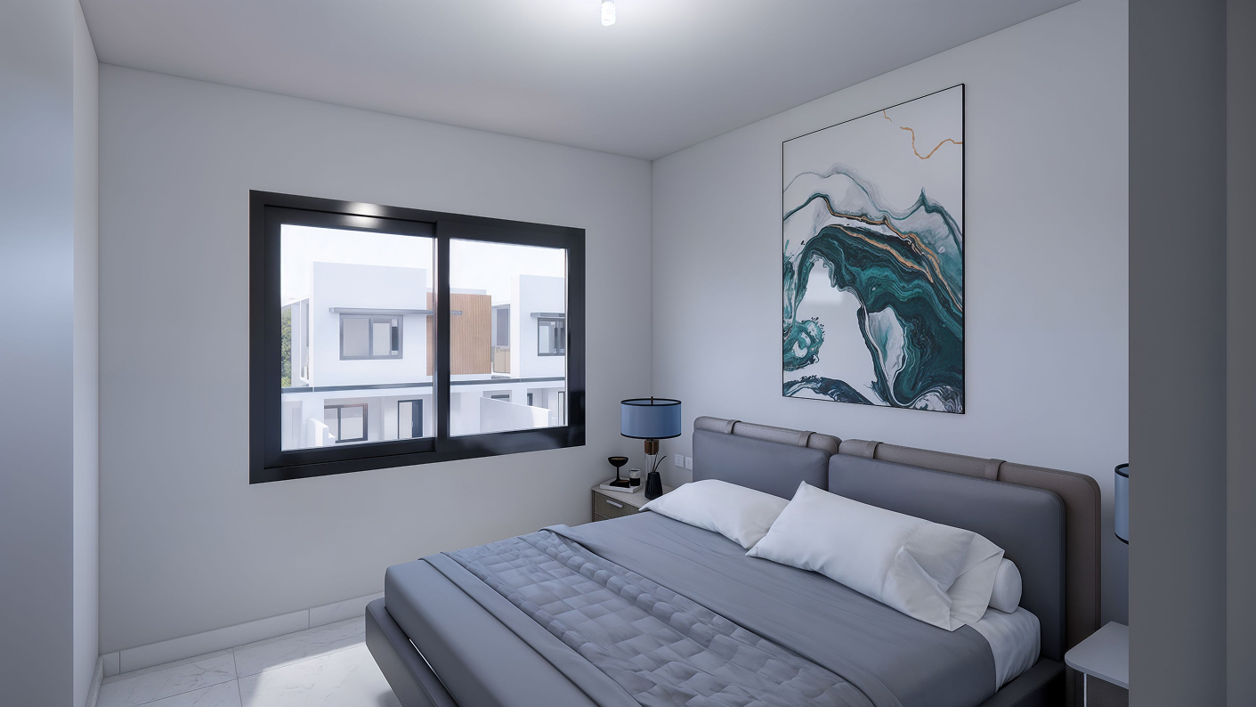 Habitación principal del modelo Aura de la residencia Angeles Residencial en Chihuahua, que presenta una cama y un cuadro en la pared.