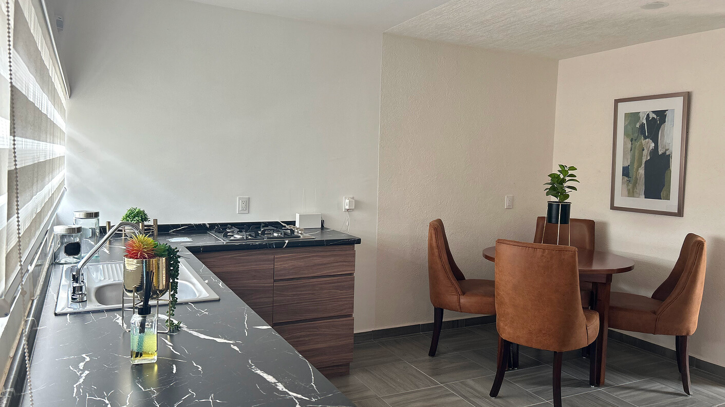 cocina y comedor de casa modelo sauce en desarrollo paseos del bosque en el estado de Aguascalientes Mexico del desarrollador inmobiliario frindsa